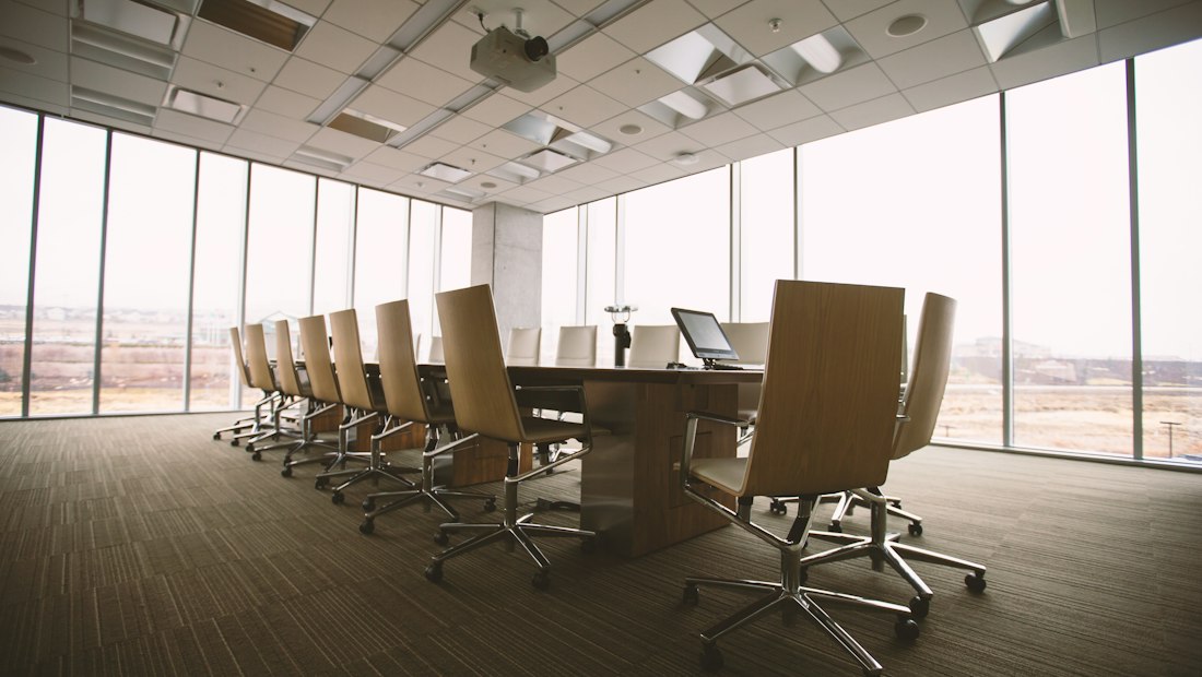 Board meeting room with a long conference table