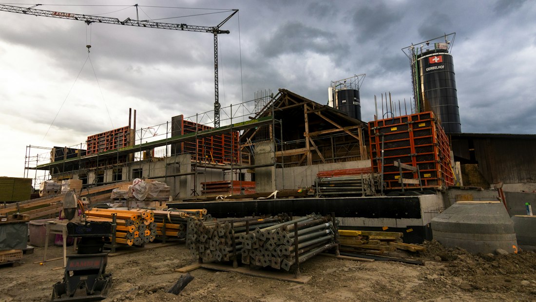 Building addition under construction with a crane